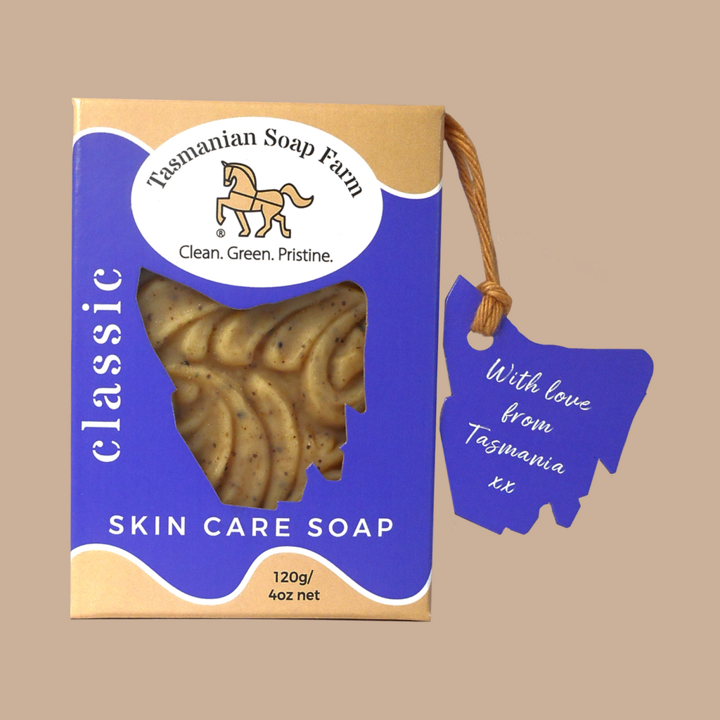 Tasmanian Soap Farm Classic Skin Care Soap, by Tasmanian Soap Farm, in a purple and buff box with a window showing the textured soap inside, plus a purple hangtag with white script.