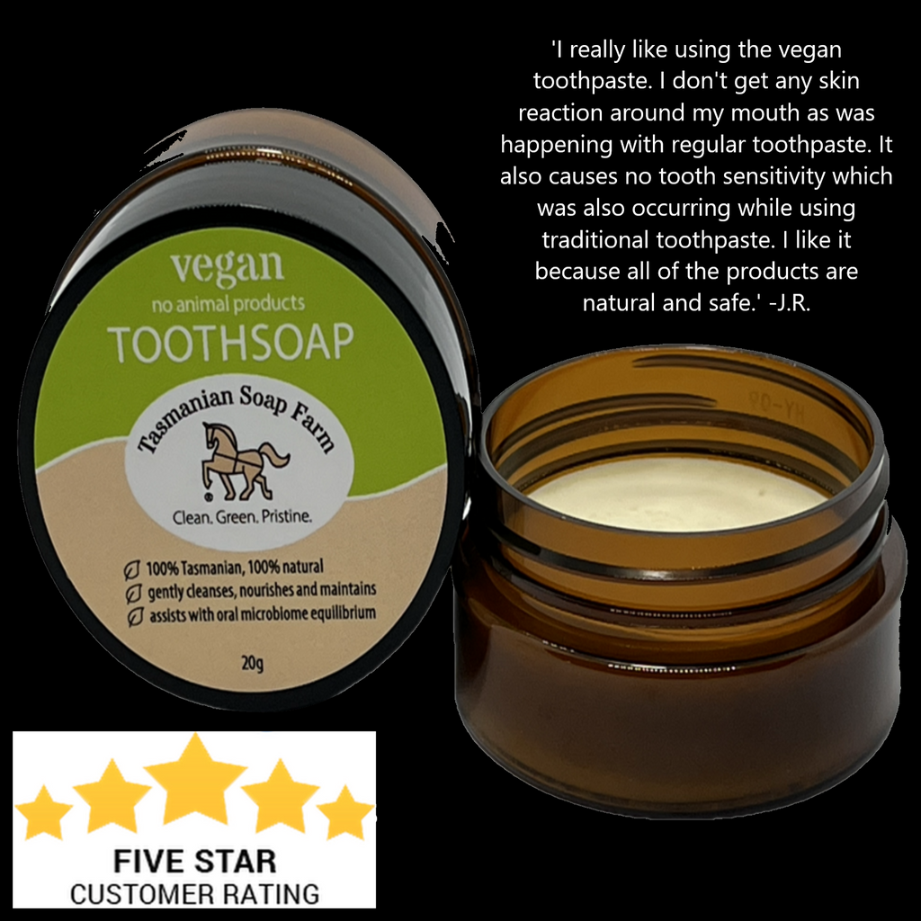 Tasmanian Soap Farm vegan toothsoap in an amber PET pot, shown open with cream inside alongside the product label. A customer review quote and a five-star rating graphic are displayed on a black background.