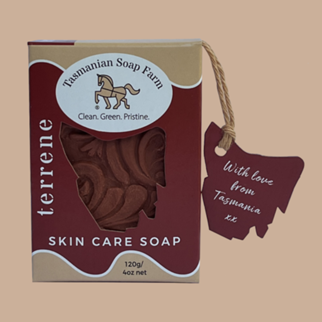 Tasmanian Soap Farm 'terrene' skin care soap in its original packaging box, featuring a window that shows the red ochre soap bar inside and a matching  hangtag with a handwritten-style message.