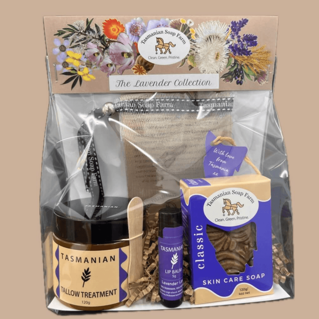 Tasmanian Soap Farm's 'The Lavender Collection' gift set in a clear cello bag with a floral header card. The set includes a jar of Tasmanian Tallow Treatment, a tube of Lavender Lip Balm, a box of Classic Skin Care Soap and a soap net.